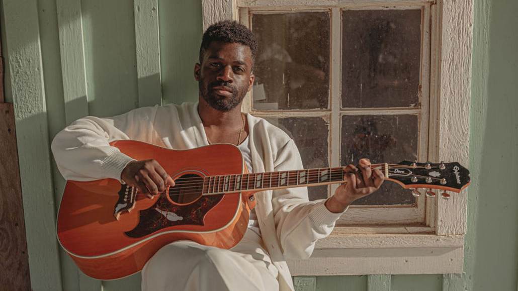 Gibson Marquee Artist Abraham Alexander pictured with his Epiphone Dove